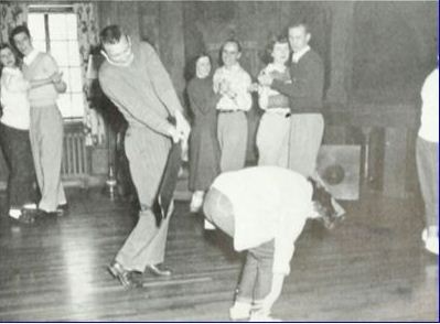 spankee bending her knees at a 1951 Iowa paddle party
