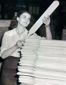 sorority girl gazes lovingly at a hugle pile of spanking paddles