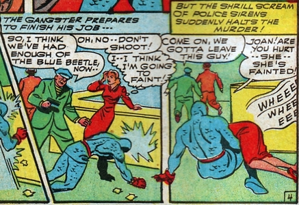 Joan falls over Blue Beetle's knee.