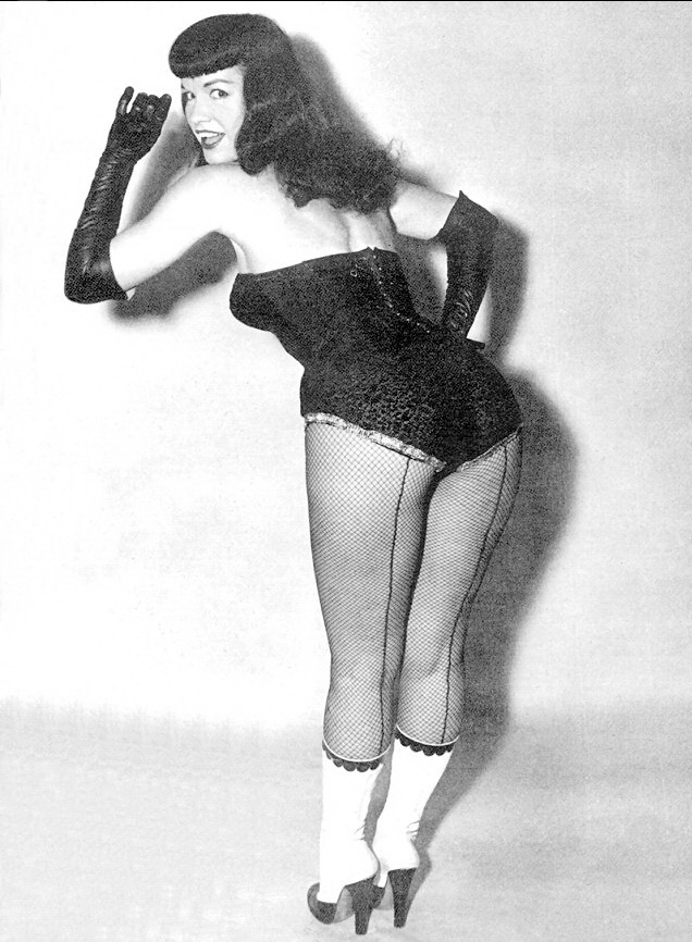 Bettie in black and boots.
