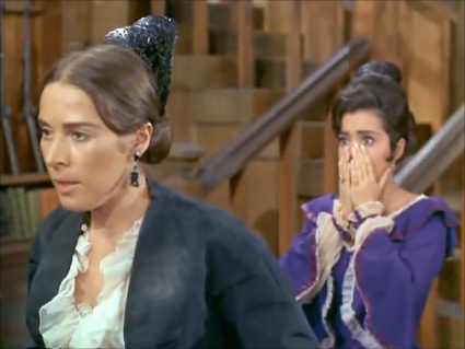 joan hackett feels the sting as her female servant looks on in horror