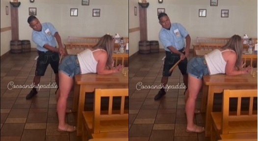 woman gets spanked with a paddle at the hofbrauhaus german restaurant