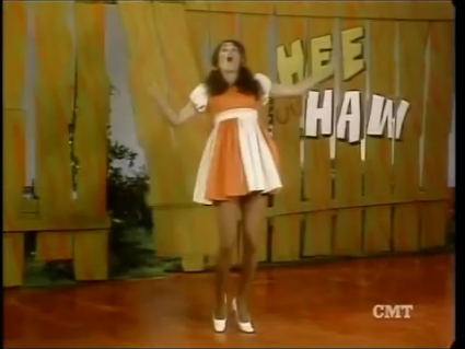 girl whacked with board on hee haw