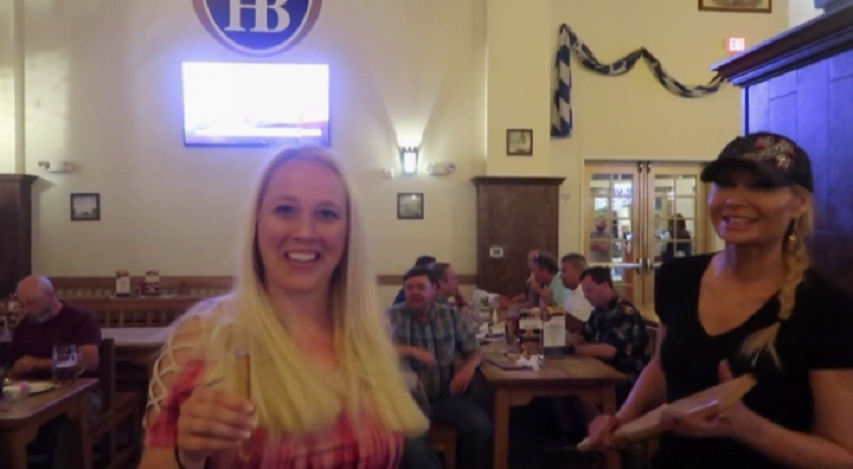 girl gets paddled at the hofbrauhaus